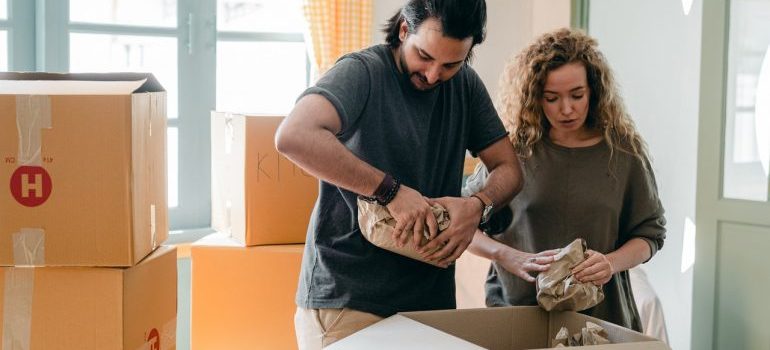 A couple wrapping their belongings