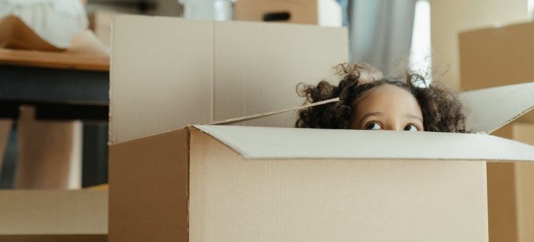 A little girl inside the box