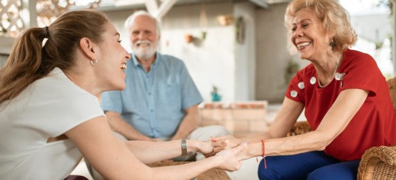 Elderly parents and their daughter