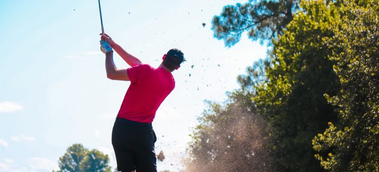 A man playing golf