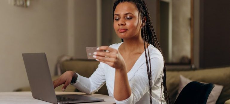 A woman looking at her credit card