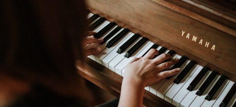 a woman playing piano