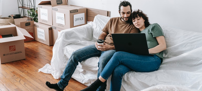 a woman reading the article titled Why you need professional movers when relocating to Fort Lauderdale