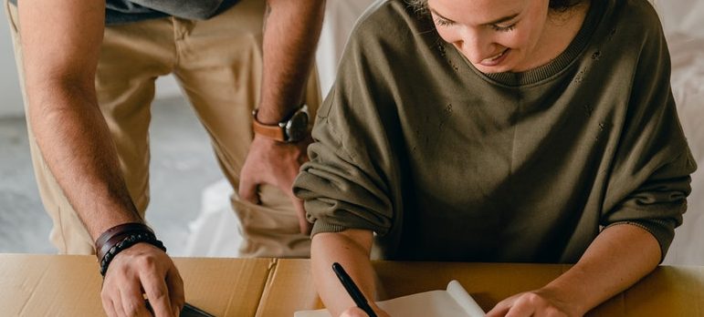 a couple packing for moving