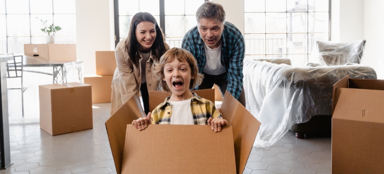 Happy family playing during relocation