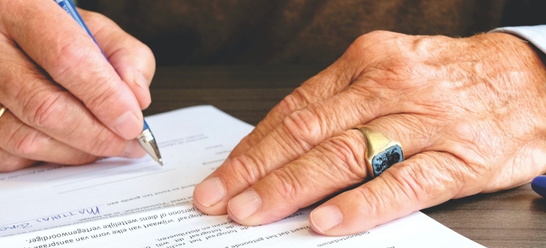 Man signing a contract