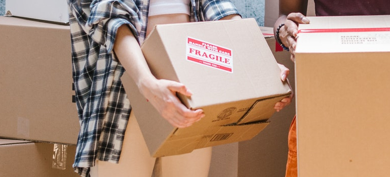 a girl holding a box