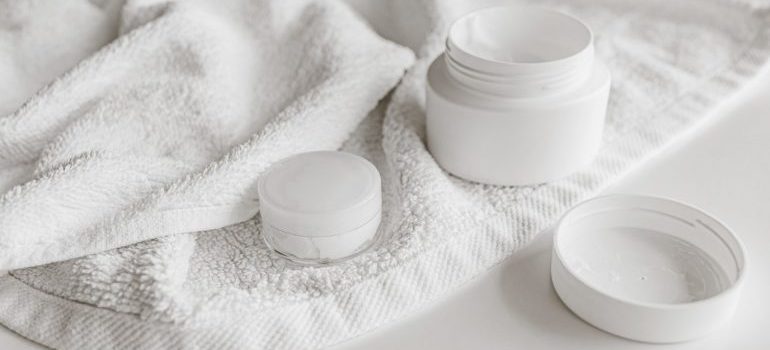 Beauty products in a white towel 