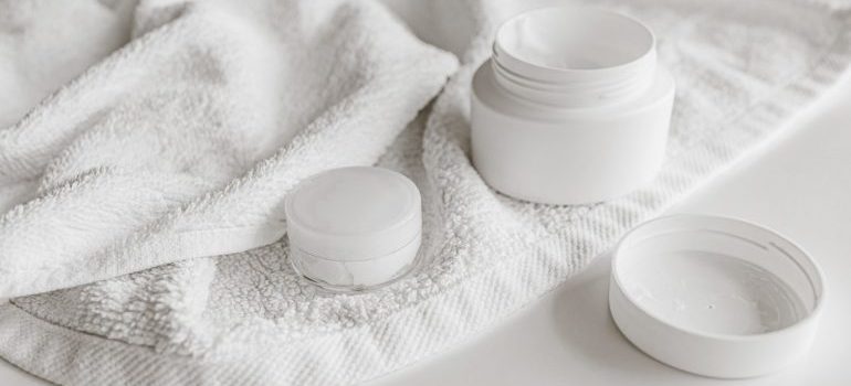 Beauty products in a white towel