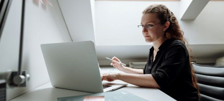 woman typing on computer