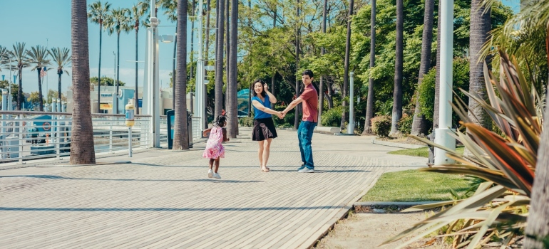 Happy family walking by the beach.