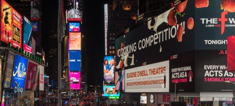 A person thinking about NYC culture shocks for newcomers from Florida while looking at the crowded streets.