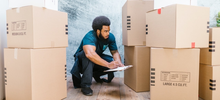 A mover looking at boxes