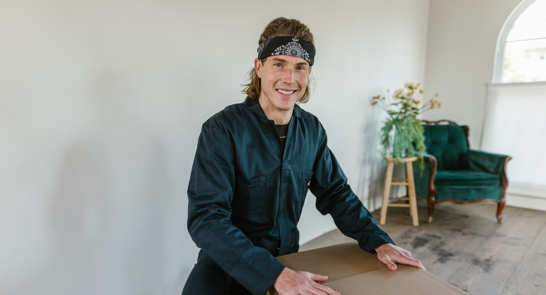 A man packing a moving box