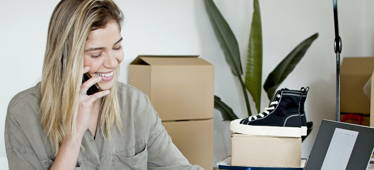 a woman talking with some of the best moving companies doral has