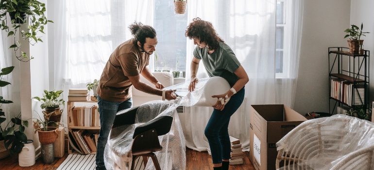 The couple wraps the furniture