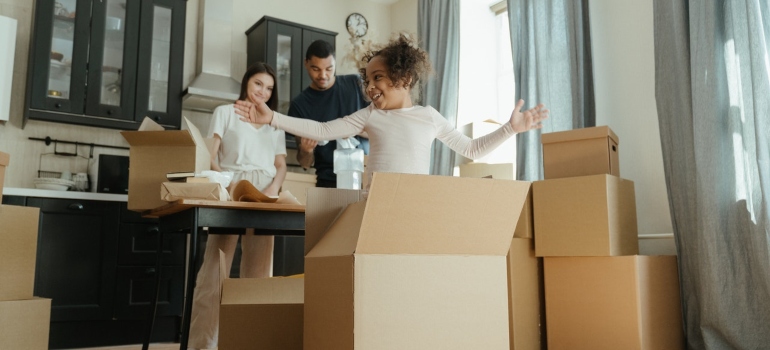 A happy family packing for the move