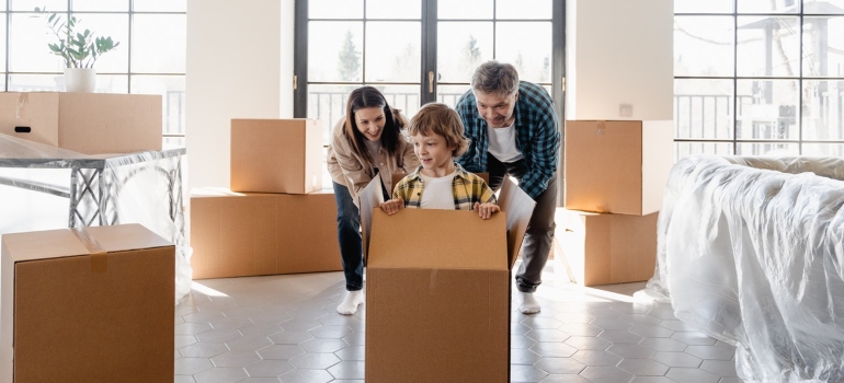 A happy family moving into a new home