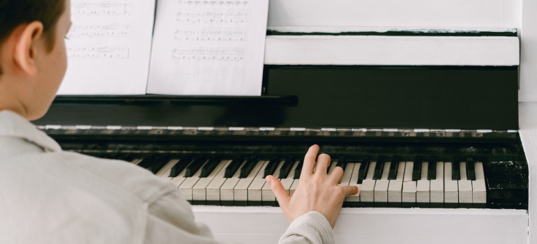 A boy playing a piano