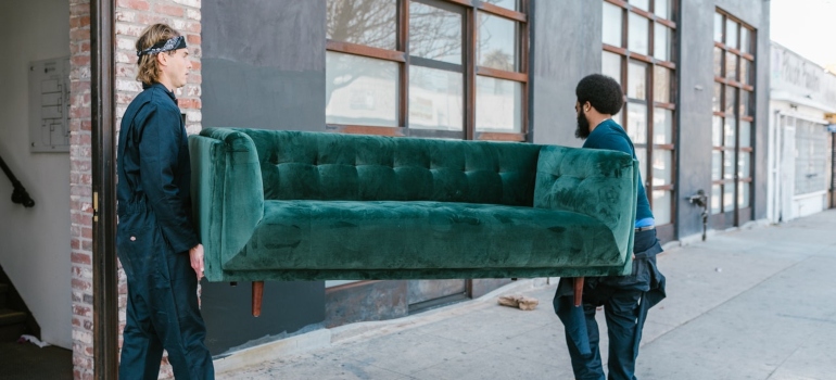 Movers Palm Springs carrying a couch