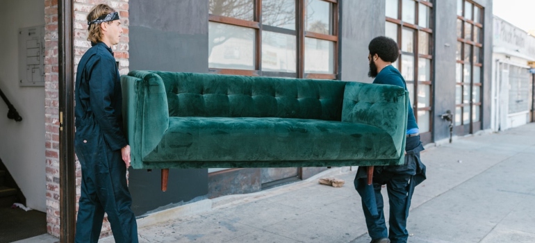 Movers carrying a couch