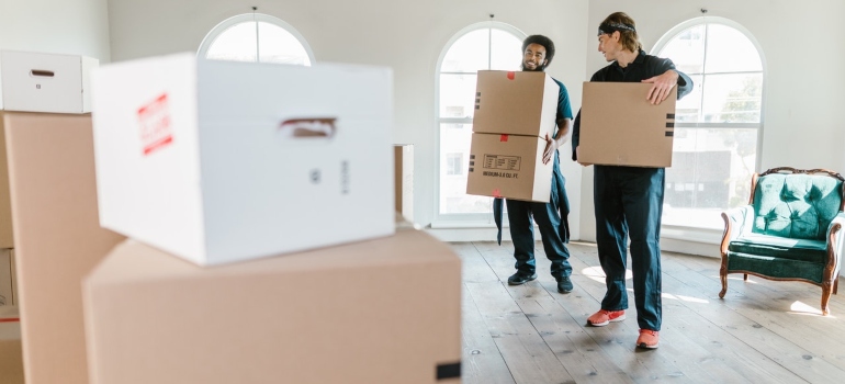 Movers carrying boxes