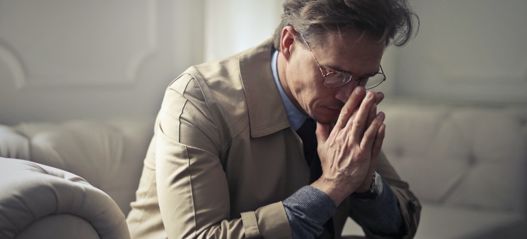 A businessman contemplating - why your moving business is failing