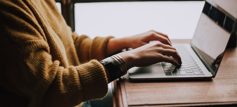 A person typing on a computer