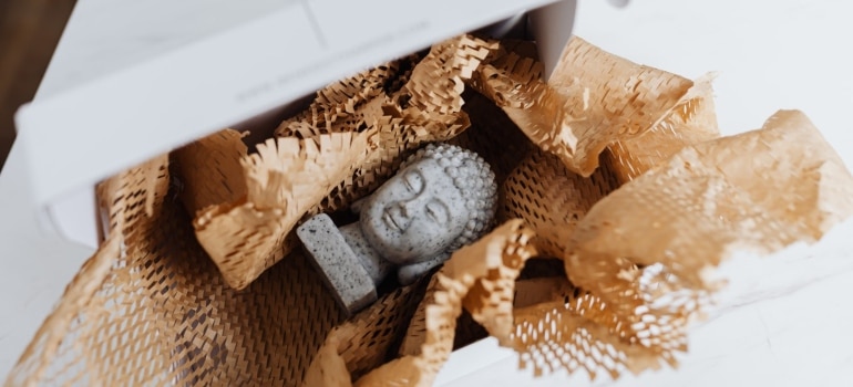 A statue of Buddha in a box