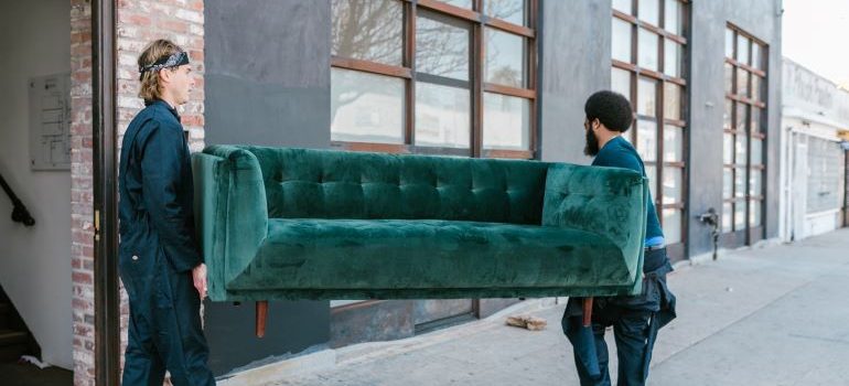 movers carrying a couch 