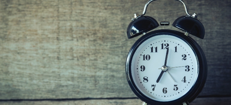 clock on the wooden table