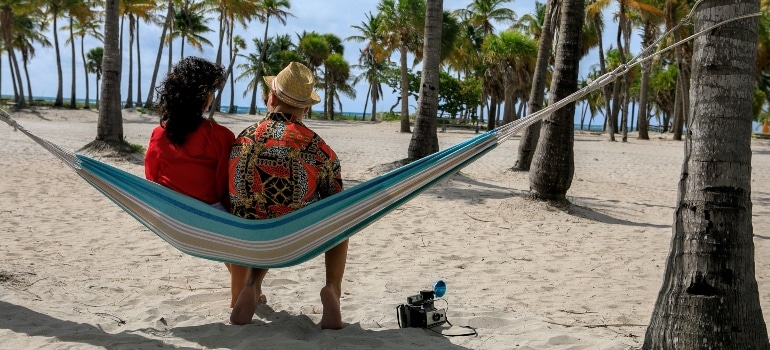 two people relaxing and discussing the best neighborhoods to raise a family in Miami