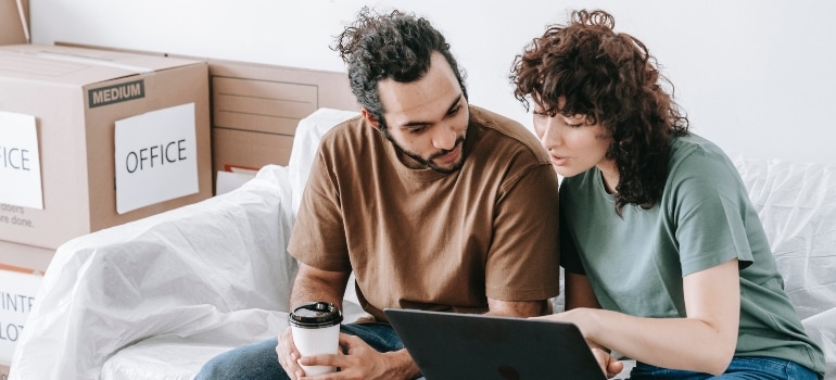 happy couple checking neighborhoods to raise a family in Miami