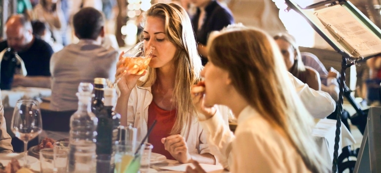 two girls having a lunch in one of the top Miami neighborhoods for foodies