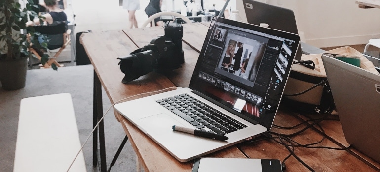 lap top and camera on desk