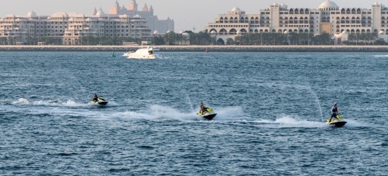 Three people jet skiing