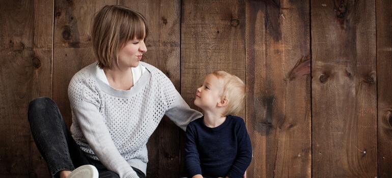 mother talking to her child about Miami neighborhoods for people with children