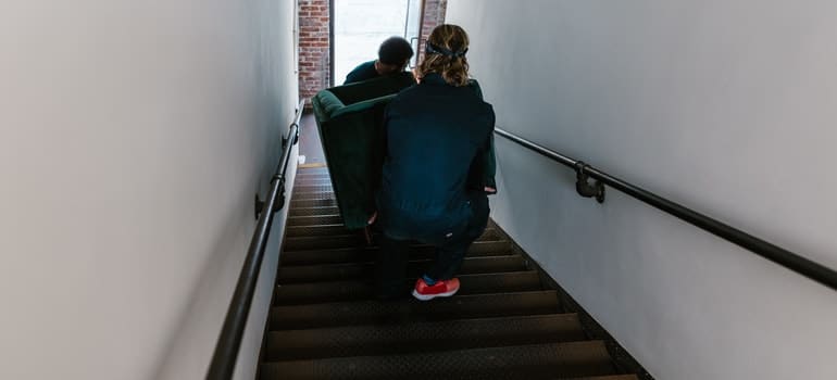 Movers going down the stairs