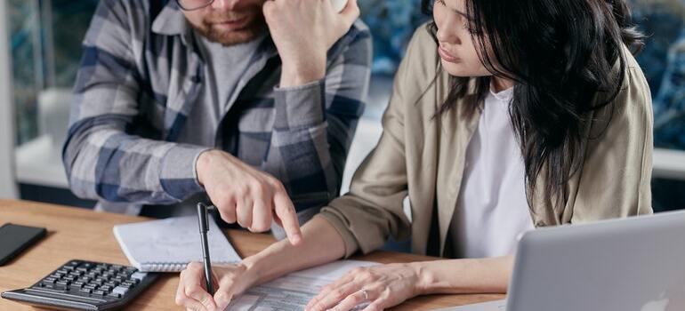 A couple looking at the calculate the cost of their Boca Raton relocation