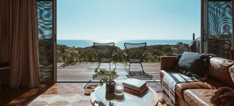 A view from terrace in apartment looking at the ocean - one of the factors to consider when buying a beachfront property in Florida 