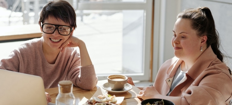 Two women enjoying a cup of coffee in a cafe