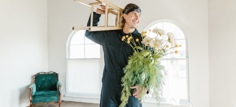 man holding items