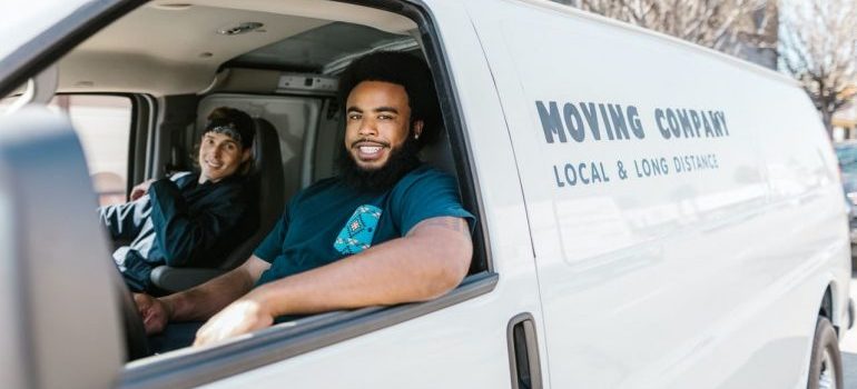 Professional movers in white van