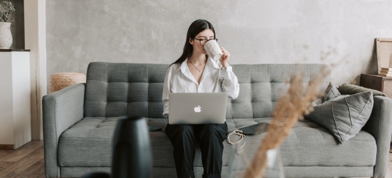 A woman searching on her laptop