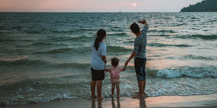 a man, woman, and girl thinking about family restaurants in Hallandale Beach