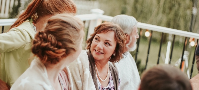 three women talking in the gaden