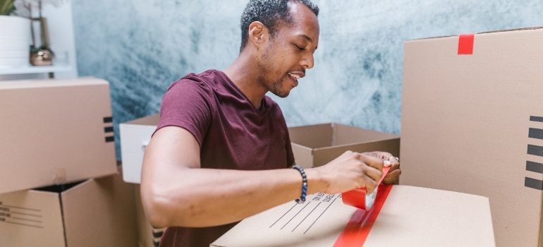 man packing his boxes