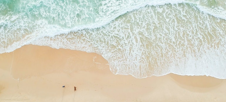 a sandy beach and blue water