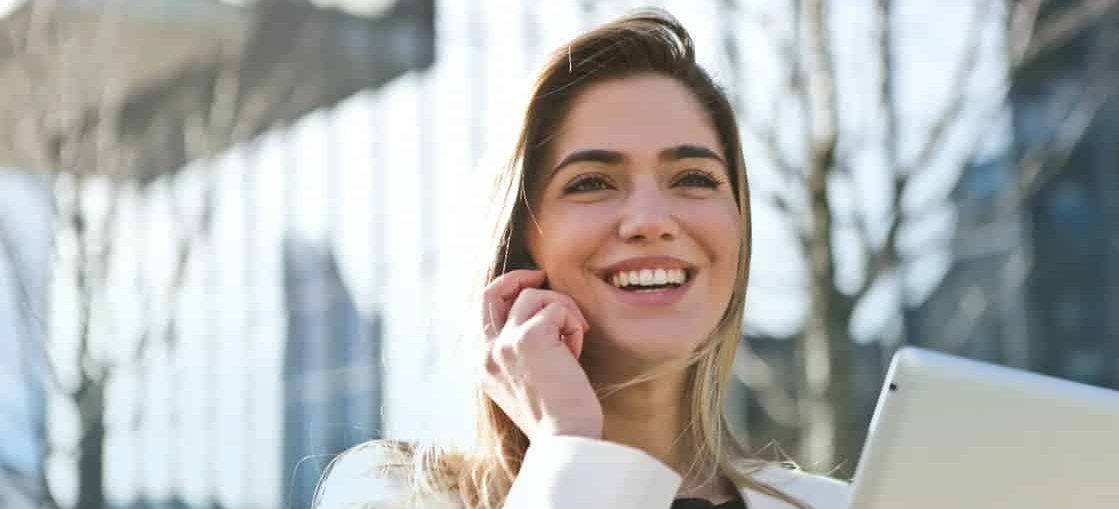 a young woman talking on the phone, smiling