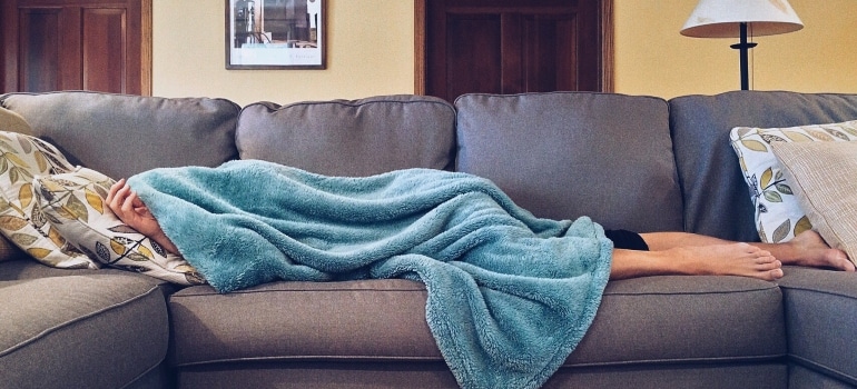 person taking a nap as one of the ways to relax after a successful Hallandale Beach relocation